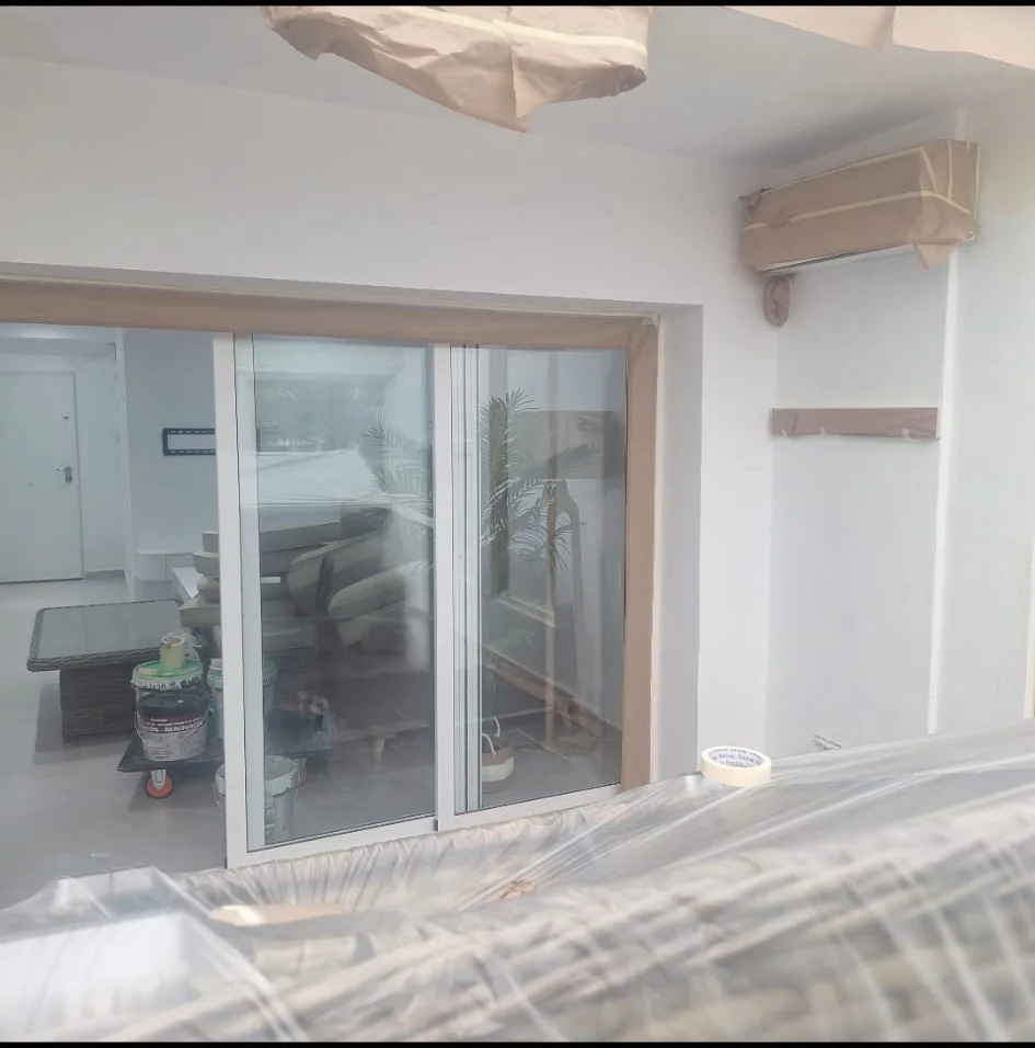 Preparation phase with protections, repairs, and primed surfaces.